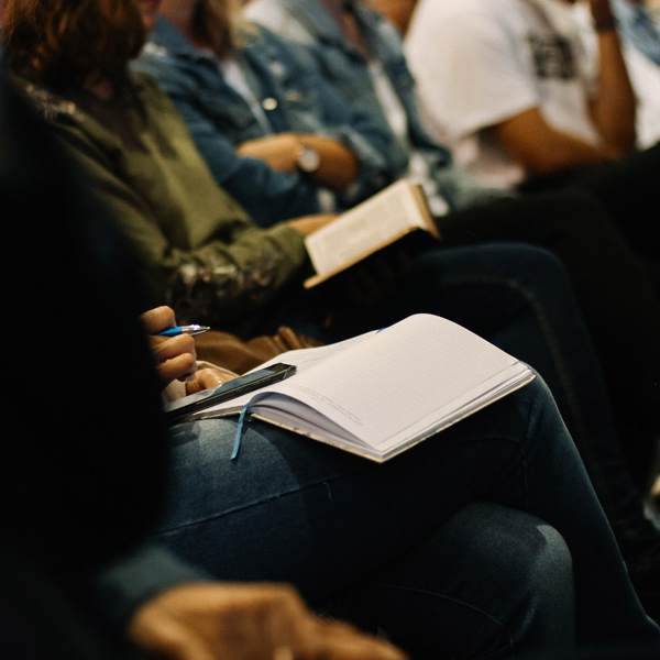 image of someone in higher education taking notes