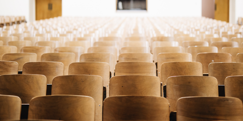 image of desks in a lecture hall